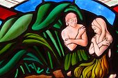 stock photo of segment  - Stained Glass window segment of Adam and Eve in the Garden of Eden - JPG 
