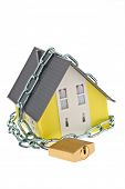stock photo of security  - a house with chain and lock shut - JPG 