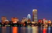 picture of reflection  - Boston city skyline at dusk with Prudential Tower and urban skyscrapers over Charles River with lights and reflections - JPG 