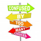 picture of many  - Several colorful arrow street signs with the words Confused By Too Many Choices - JPG 