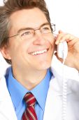 image of medical doctors  - Smiling medical doctor calling by phone - JPG 