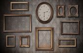 picture of watch  - empty vintage frames and watch against an dirty wall - JPG 