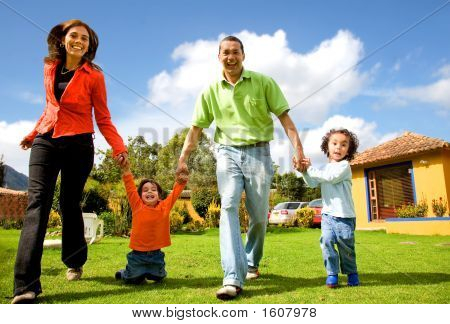 Picture or Photo of Happy family having fun outdoors at home on a sunny day