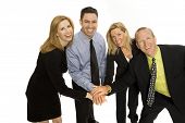 picture of business people  - Four business people gesture teamwork together against a white background - JPG 
