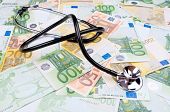 stock photo of money  - Stethoscope on the full frame of Euro money banknotes - JPG 