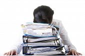 picture of pressure  - Sad woman with ringbinders sitting at the desk - JPG 