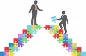 picture of merger  - Two people find connection to team up on puzzle in a merger make a deal or collaborate - JPG 