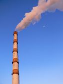 picture of blue sky  - Factory pipe smoking with a white smoke and a moon nearby over the blue sky - JPG 
