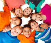 pic of group  - Circle of smiling positive kids looking down  - JPG 