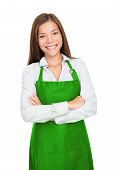 stock photo of employee  - Small shop owner entrepreneur or sales clerk standing happy and proud wearing apron - JPG 