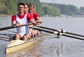 pic of sports  - Coxed four rowing team during the first strokes after the start of a race - JPG 