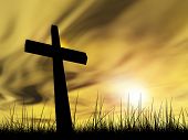 foto of religion  - Concept conceptual black cross or religion symbol silhouette in grass over a sunset or sunrise sky with sunlight clouds background - JPG 