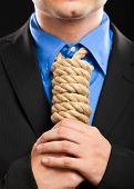 picture of pressure  - Businessman with a rope in place of a collar - JPG 
