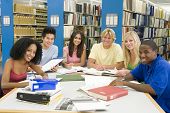 stock photo of young adult  - Six people in library studying - JPG 