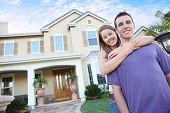 image of home  - A young couple in love in front of their new home - JPG 