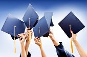 picture of group  - Group of people throwing graduation hats in the air - JPG 