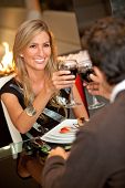 picture of restaurant  - Beautiful woman on a date at a fancy restaurant - JPG 