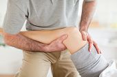 stock photo of pressure  - Chiropractor massaging a woman - JPG 