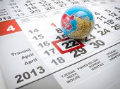 picture of earth  - Earth day marked on the calendar with a globe as a symbol - JPG 