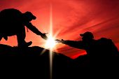 pic of outdoor  - Silhouette of helping hand between two climber - JPG 