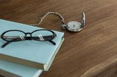 stock photo of watch  - A pocket watch and book - JPG 