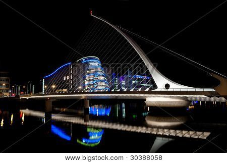 Picture or Photo of Dublin, IRELAND - AUGUST 23: Samuel Beckett Bridge, a cable-stayed bridge by architect is Santiago Calatrava, pointing to Dublin Convention Center at nighttime, on August 23, 2011 in Dublin, Ireland