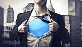 picture of businessmen  - Closeup of a businessman showing the superhero suit under his shirt - JPG 