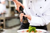 pic of restaurant  - Chef in hotel or restaurant kitchen cooking - JPG 
