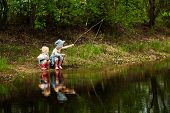picture of bridge  - Little girls are fishing on lake in forest - JPG 
