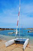 stock photo of hut  - a sailboat and the Mediterranean Sea in Cala Sa Roqueta cove - JPG 