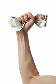 stock photo of currency  - Hand of male caucasian crumpling a bunch of european currency bills - JPG 