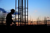 foto of construction  - Builder Silhouette at Construction Site at Dusk - JPG 