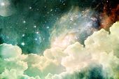 image of surreal  - A photobased cloudscape with clouds stars and moon with distant galaxies - JPG 