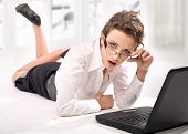 stock photo of web internet  - Young worried businesswoman with notebook in stress in the office - JPG 