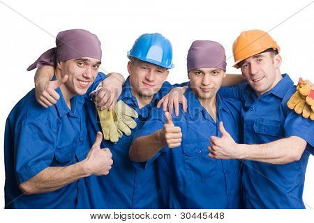 Picture or Photo of A friendly young team of construction workers shows thumbs sign okay.