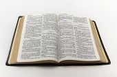 stock photo of religion  - A photo of an open Bible isolated on a white background - JPG 