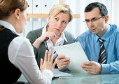 picture of meeting  - mid adult couple meeting with financial planner or advisor - JPG 
