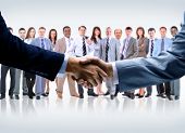 pic of handshake  - handshake isolated on business background - JPG 