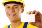 picture of construction worker  - Worker showing his business card and smile isolated over white - JPG 