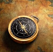 foto of map  - An old fashioned brass compass on a Treasure map background - JPG 