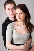 image of young adult  - young happy teenage couple in love embracing - JPG 