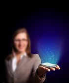 pic of business people  - Business woman holding a mobile phone sending images - JPG 