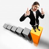 picture of business people  - Young attractive business woman on the highest bar of a 3d graphic - JPG 