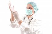 stock photo of medical doctors  - Female medical doctor with stethoscope wearing operation gloves - JPG 