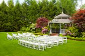 stock photo of reception  - A gazebo and white chairs at a wedding venue for the ceremony and reception - JPG 