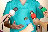 picture of meeting  - Conference meeting microphones and doctor - JPG 