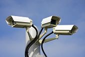 image of security  - Security cctv cameras in front of blue sky - JPG 
