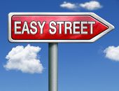 picture of comfort  - easy street road sign arrow indicating easy solutions or a way to avoid problems safe way taking risk comfortable comfort zone secure route safe way - JPG 