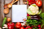 image of health  - Vegetables and Spices on a Wooden Background and Paper for Notes - JPG 