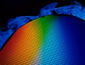 foto of silicon  - detail of a silicon chip wafer reflecting different colors - JPG 